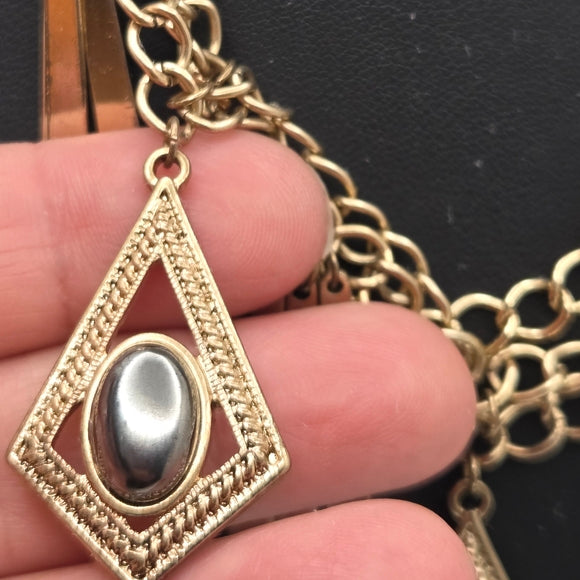 Gold Statement Necklace with Geometric Accents