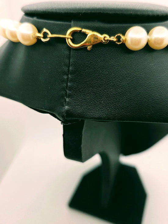 Vintage Creme-Perlenkette mit goldener Quaste